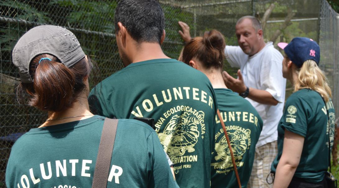 Volunteers learn about the wildlife staying at the animal rehabilitation centre in Peru Projects Abroad Conservation Director tells the volunteers about the animals at the rescue centre in Peru
